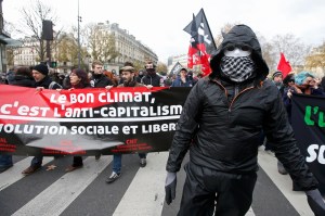 People demonstrate near the Place de la Republique after the cancellation of a planned climate march following shootings in the French capital, ahead of the World Climate Change Conference 2015 (COP21), in Paris, France, November 29, 2015.             REUTERS/Eric Gaillard